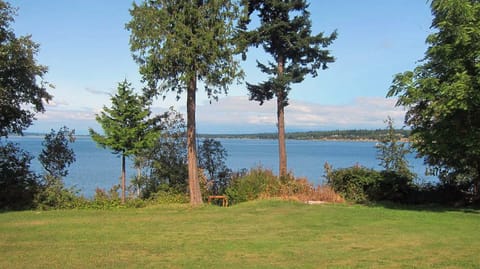 Backyard with private stairs to the beach.