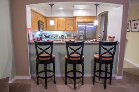 Breakfast bar opens up to kitchen and living room for easy family fun & laughs.
