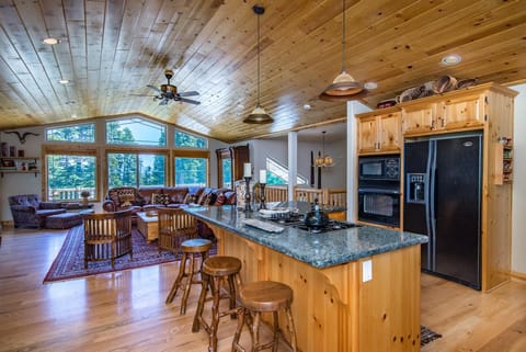 Kitchen , Great Room, Deck overlooking conservancy land and peek of lake