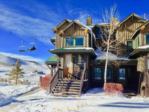 The front door is just right of the tree - 50 feet from slope to condo!