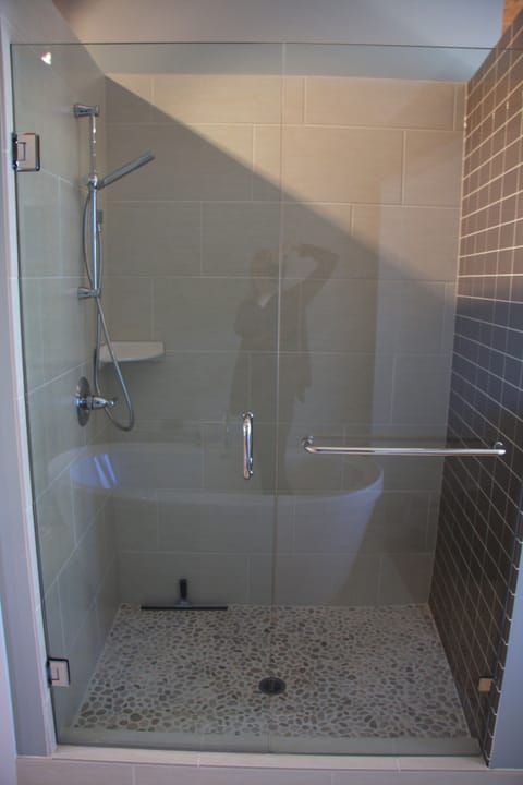 Pebble floor shower feels great on the feet.