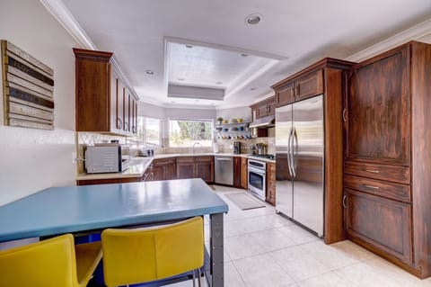 Kitchen flows into the dining room and there are sliders to the side yard