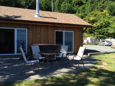 Ocean side of cottage with parking space to right
