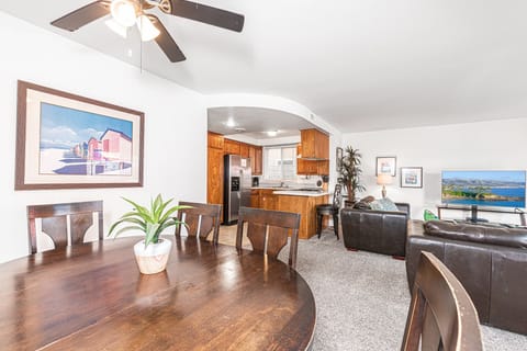 Spacious, open floor plan between living, kitchen and dining areas. Carpeting throughout.
                