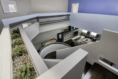 main staircase showing downstairs living area