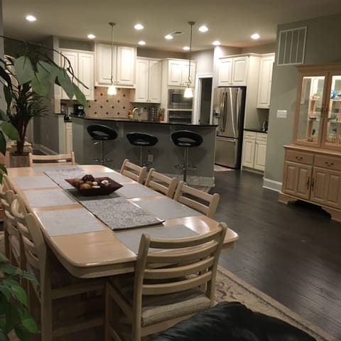 View from Great Room showing dining table and kitchen.