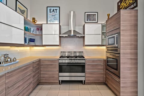 Chef`s Kitchen with Stainless Appliances and Full Prep Space