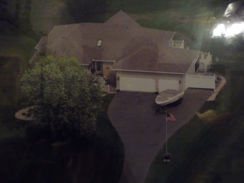 Ariel View...Property is on a 1.2 acre lot with 117 feet of frontage on the Lake