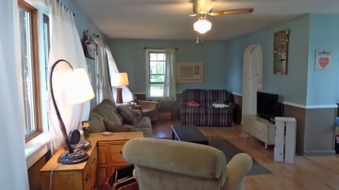 Living room with plenty of seating. Flat screen TV with cable TV over Slingbox.
