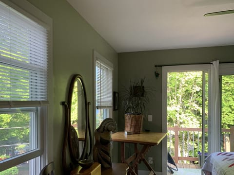 Master bedroom with view of deck