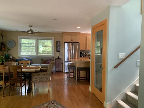 Dining area to kitchen with stairwell to second floor