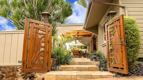Through Hand Carved Teak Gates The Experience Begins...