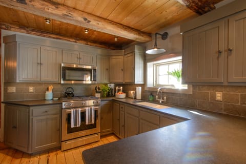 The kitchen.  New glass and china - light and roomy.