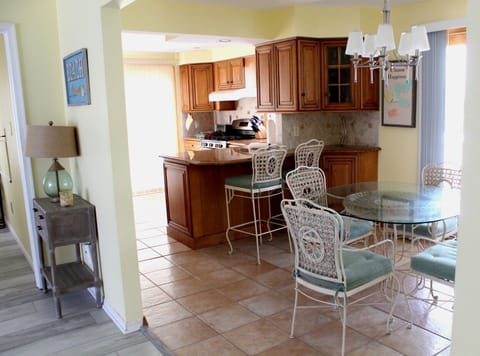 Steps from living area to kitchen to pool