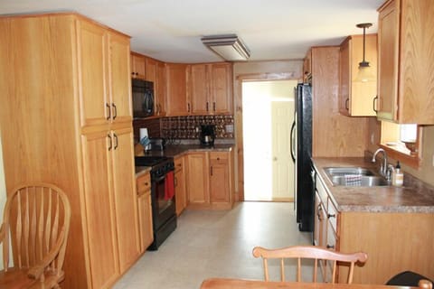 Newly renovated kitchen is just steps from the back deck.