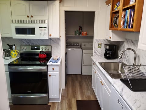 Kitchen looking into laundry room