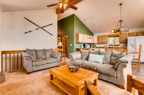 The living area has comfy sofas and chairs so that your entire group can relax and enjoy a movie or the beautiful views.