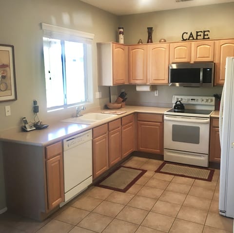 Electric stove, microwave, dishwasher; as well as dishes, glassware & silverware