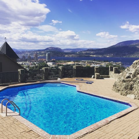 2nd level of outdoor living area with solar heated pool and new hot tub 