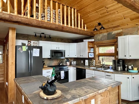 Updated and fully stocked kitchen makes cooking a pleasure.