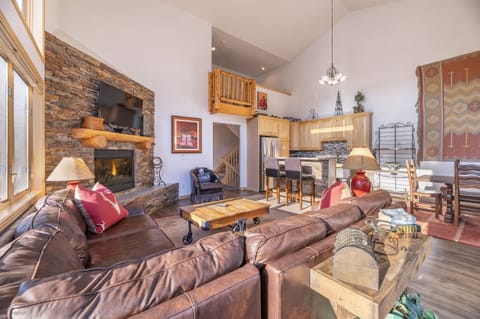Unit 190 Living room: fireplace, Queen fold-out, flat screen TV, & private deck.