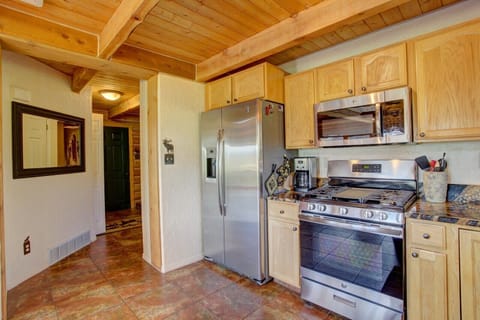 Hall opens to Kitchen; Radiant Floors, Chef's Gas Range, Stocked Pantry