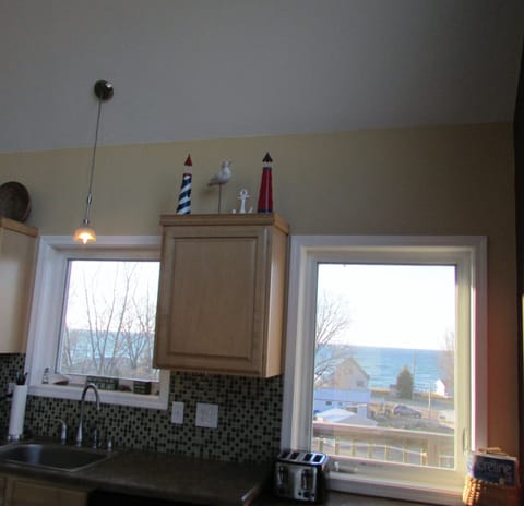 Two windows in kitchen facing Lake Michigan, beautiful views.