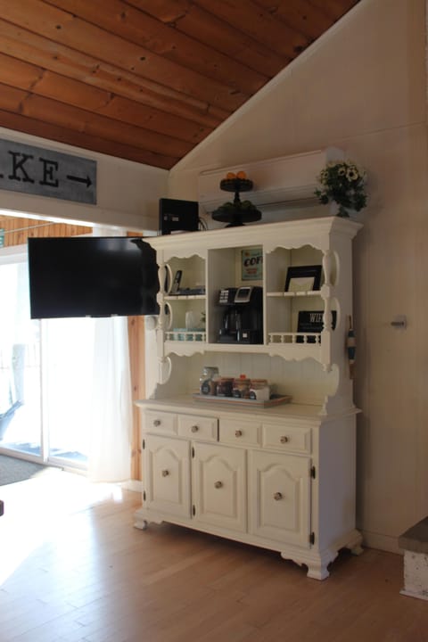 TV rotates from Kitchen to living room in main house.