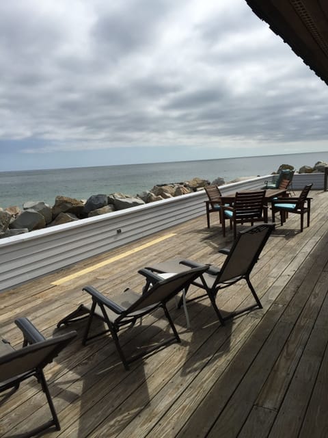 Large front deck runs full length of the house and has plenty of tables & chairs