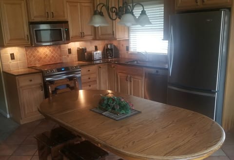 Fully Stocked Kitchen/Dining Area  Adjoins  Living Room 

