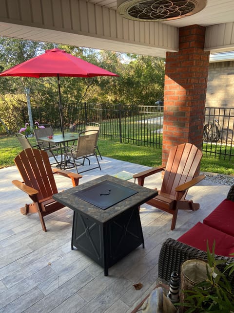 Outdoor sitting area for drinks and fireplace