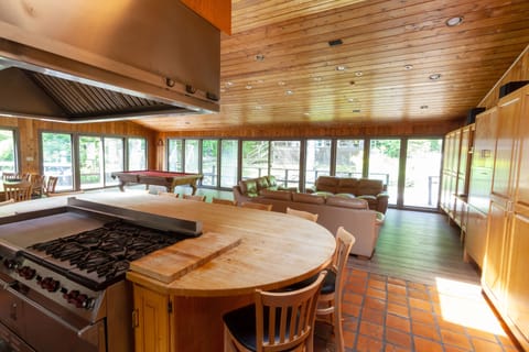 Counter island- wraps around range with seating for 10