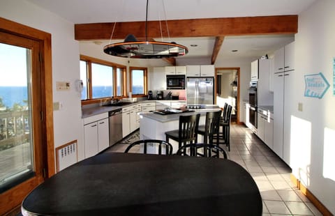 Water views in the kitchen and dining room beyond