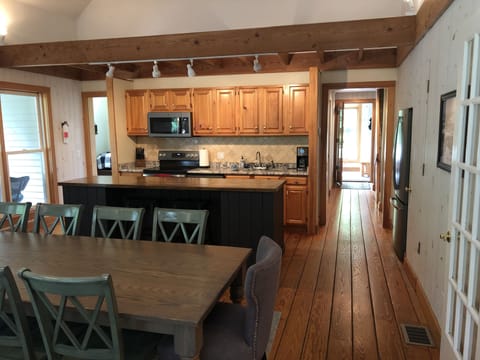 Master bedroom to the left of kitchen. Entryway and den to the right. 