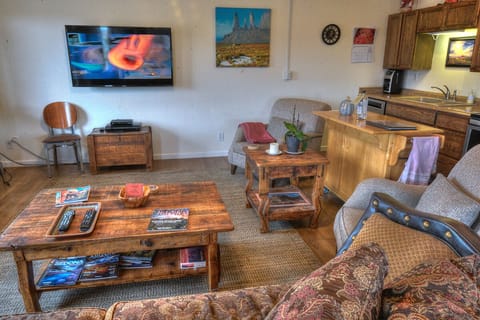 Living room comfy couch.  Chairs with Thunder Mountain View