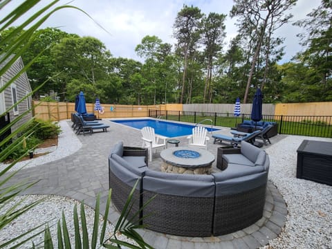 After a day at the beach and dip in  the pool, relax around a  gas fire pit