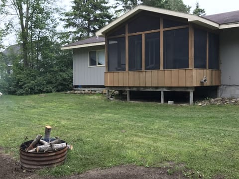 Back of the house with screened in porch!