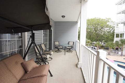 Bottom Balcony has Table Chairs and Swing