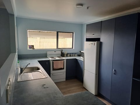 Kitchen with extra fridge in garage