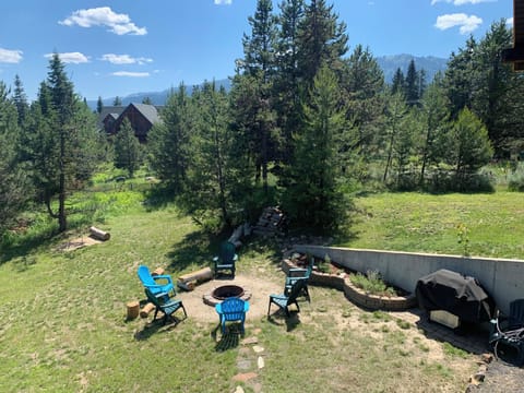 View from porch. Horseshoe pit, fire pit and grill shown.