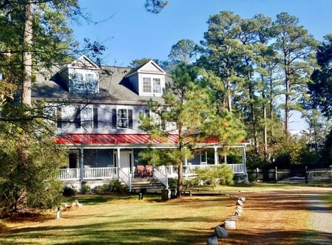 Our home blends into towering pines, lawns & hundreds of feet of waterfront