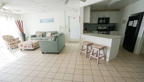 Flat-screen TV, DVD player, books, stereo