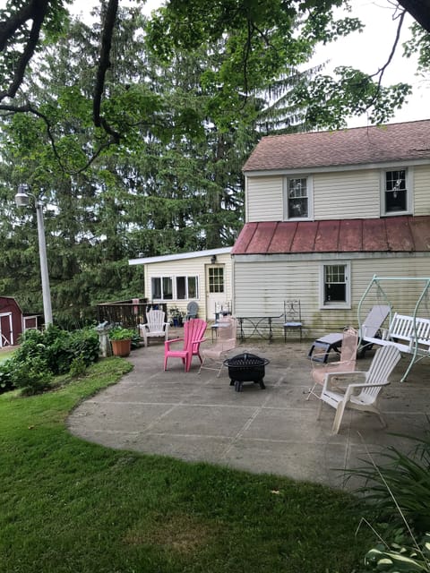 Patio at back of house with Fire Pit for summer lounging enjoyment. 