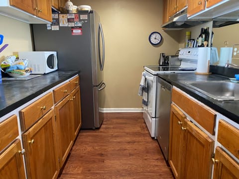 Fully stocked kitchen with blender, keurig,  and drip coffee pot.