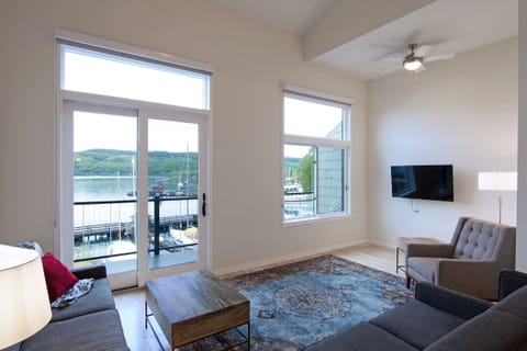 Livingroom with deck access and view of lake
