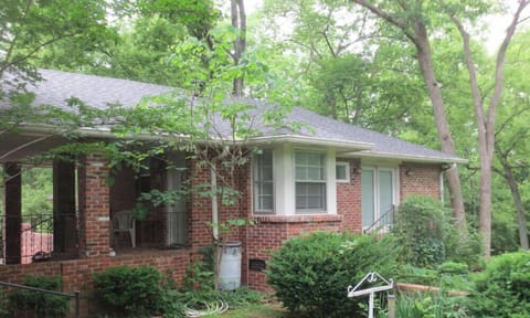 Private guest house  with large  yard and tall trees. 