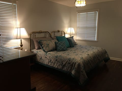 King-size bed in large bedroom.