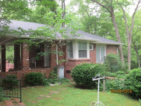 Private guest house  with large  yard and tall trees. 