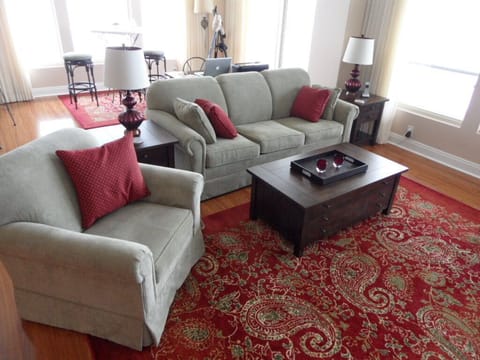 Comfort is key in the seating area. A Queen sleeper adds bedding for guests.