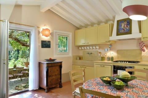 The kitchen, with the terrace and the outdoor dining table outside.